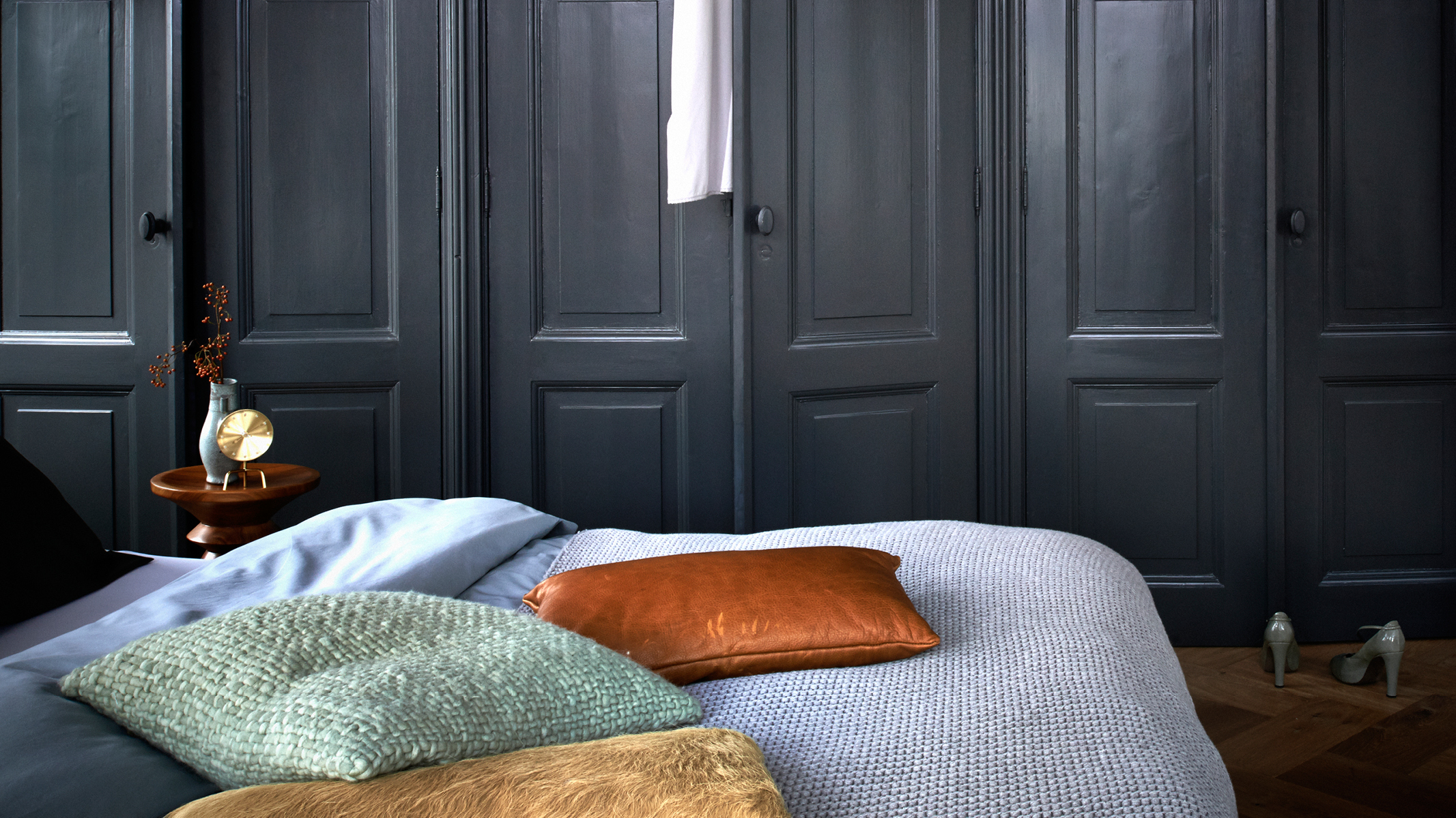 Dark blue bedroom Daring decorators may like to try darker shades of neutrals for a dramatic yet cosy feel in the bedroom.