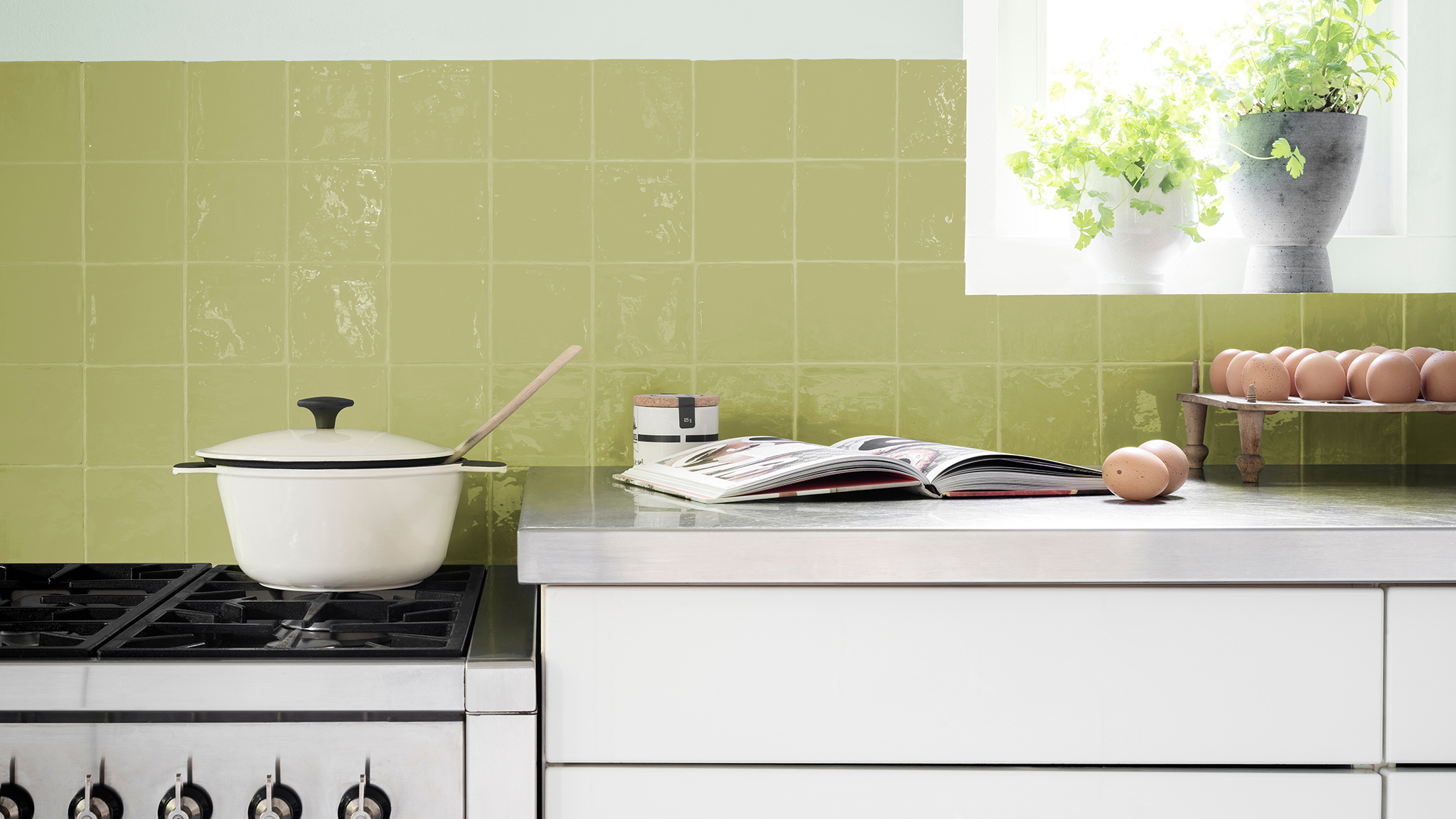 Green tiles with white cabinets and a small window. dulux-simply-refresh-tiles-ideas-global-3