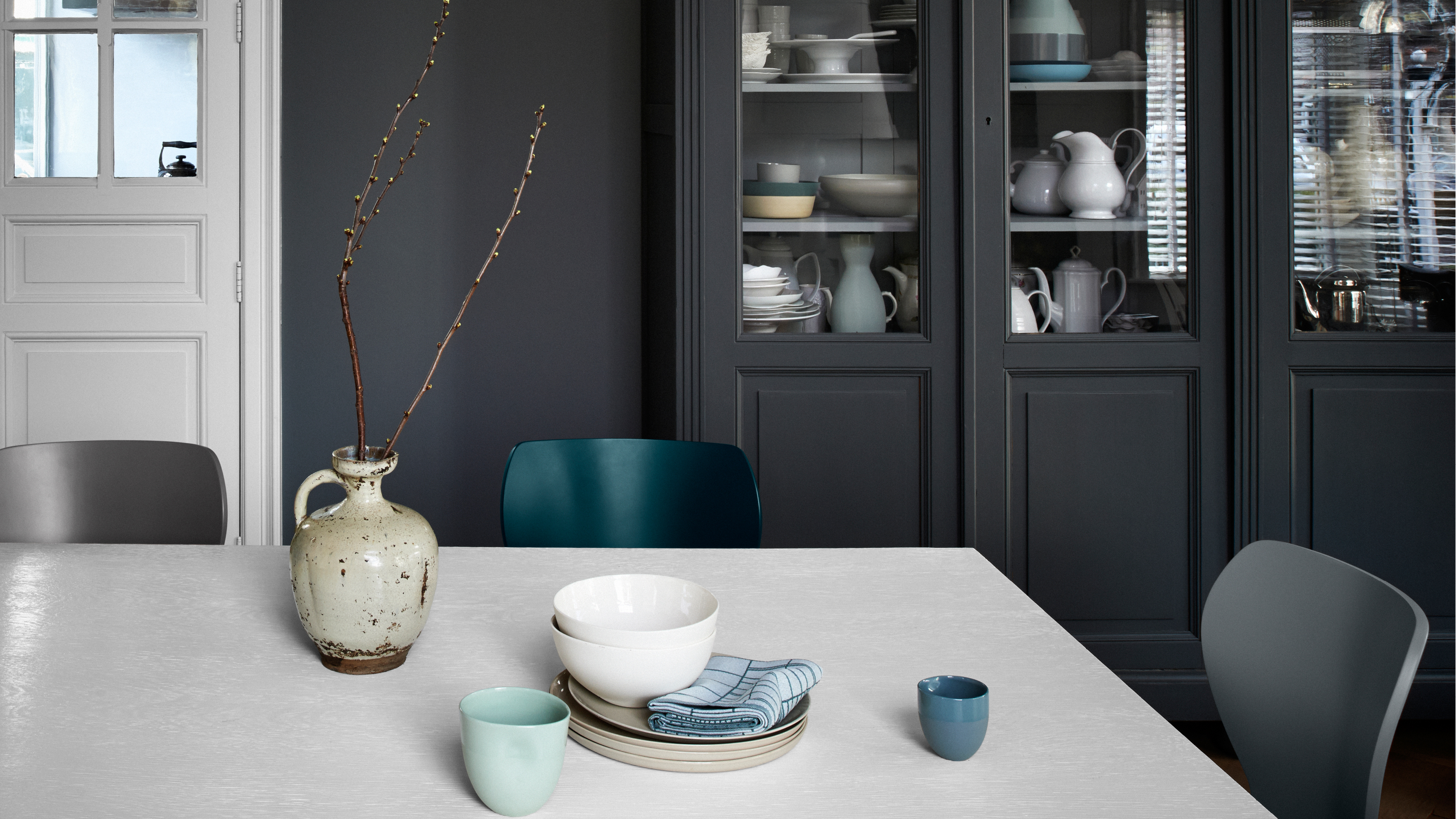 Use dark colour to create a cosy kitchen Dark colours have a reputation for being forbidding but they can actually be incredibly cosy.